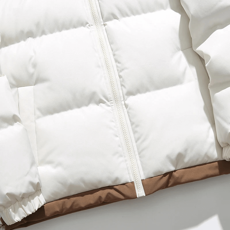 Trendy warm hooded zipper puffer jacket with patchwork, perfect for winter. Features a cotton-polyester blend and broadcloth fabric.